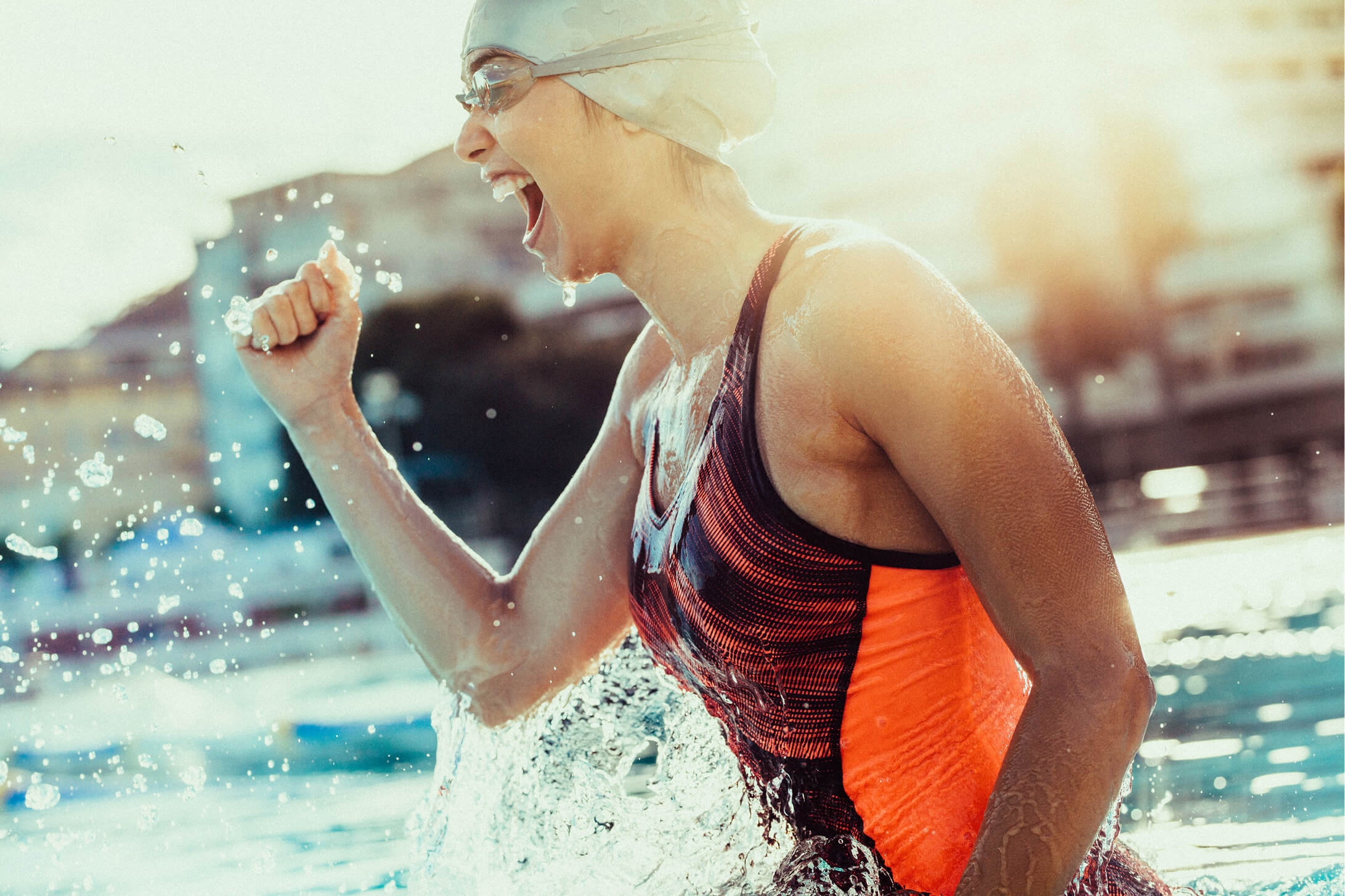 A woman in the water with her mouth open.